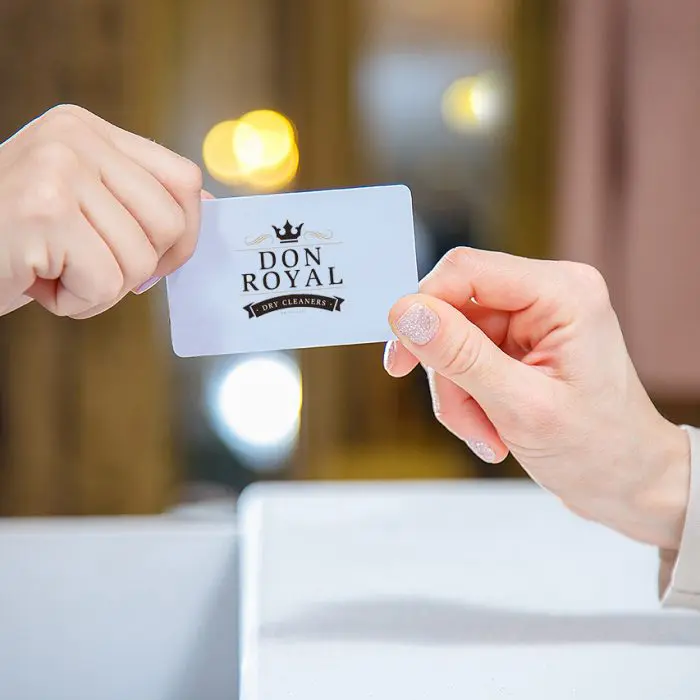 Don Royal loyalty card handed across the counter